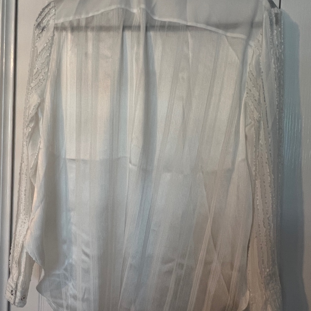 White T Tahari White blouse.  May be worn tuck or as a tunic type.
